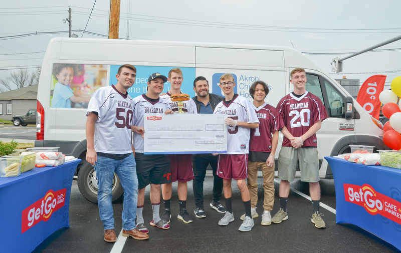 GetGo presented the Boardman High School Boys Lacrosse team with a check for $1,500 at the grand-opening ceremony of the new GetGo gas station/cafe/market at 133 Boardman-Poland Road in Boardman on Thursday May 3, 2018. From left to right is #50 - Cody Geary, #9 - Devin Whitaker, #55 - Clayton Wehr, Adam Richman - celebrity chef, #25 - Jett Ventresco, #1 - Colin Frost, and #20 - Mitchell Brunko. 

Photo by Scott Williams - The Vindicator.