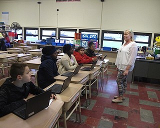 Neighbors | Zack Shively.Each of the students at Market Street Elementary have online accounts for their Everyday Math curriculum. These accounts give them access to games that they can play in class or at home. Pictured, fourth-grade teacher Denise Robinson had the students show their parents examples of the games.