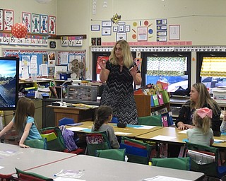 Neighbors | Zack Shively.The math night gave parents the chance to see what happens in their students' classroom, and it also taught parents games and activities to do with their children that would be fun and educational. Pictured, kindergarten teacher Pam Choleva explained a game featuring dice for the parents to play with their children.