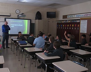 Neighbors | Zack Shively.Jack Azar, a chemical engineer for Ergon, said he became a speaker at Holy Family School's career day through the teachers. His son goes to the school and he wanted to give the students a chance to learn about the possibilites at a factory like Ergon. Pictured, Azar took questions from the students about his work.