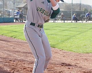 Hector Rosa, a Ursuline High School sophomore, is a catcher on the Ursuline Baseball team.  Rosa came to Austintown with his family after his hometown in Puerto Rico was destroyed by hurricane Maria.  He uses a translator, Cristian Perez, a Ursuline freshman.  Perez is also the team's student team manager.  Photo by Christine Yoder.