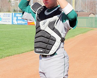 Hector Rosa, a Ursuline High School sophomore, is a catcher on the Ursuline Baseball team.  Rosa came to Austintown with his family after his hometown in Puerto Rico was destroyed by hurricane Maria.  He uses a translator, Cristian Perez, a Ursuline freshman.  Perez is also the team's student team manager.  Photo by Christine Yoder.