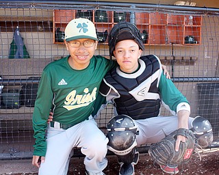 Hector Rosa, a Ursuline High School sophomore, is a catcher on the Ursuline Baseball team.  Rosa came to Austintown with his family after his hometown in Puerto Rico was destroyed by hurricane Maria.  He uses a translator, Cristian Perez, a Ursuline freshman.  Perez is also the team's student team manager.  Photo by Christine Yoder.