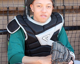 Hector Rosa, a Ursuline High School sophomore, is a catcher on the Ursuline Baseball team.  Rosa came to Austintown with his family after his hometown in Puerto Rico was destroyed by hurricane Maria.  He uses a translator, Cristian Perez, a Ursuline freshman.  Perez is also the team's student team manager.  Photo by Christine Yoder..