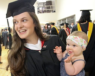 William D. Lewis The Vindicator Leah Stauffer of Youngstown shares a moment with her daughter Selah Stauffer, 8months, before YSU commencement Saturday 5-5-18. Leah recieved a masters of arts in English degree.