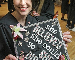 William D. Lewis The Vindicator  Alexis Smith of Lisbon shows off her motar baord before YSU commencement Saturday. Smith, of Lisbon, earned a general studies degree.