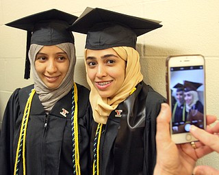 William D. Lewis The Vindicator YSU BS in Respiratory Care gradsSara Abdullah Alhayak, left, and Fatimah Faisal Anemer pose for a photo before 5-5-18 commencement ceremony. Both are from Saudia Arabia and are returning there after graduation.