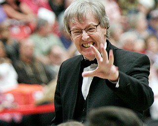 William D. Lewis The Vindicator  Stephen Gage, Director of Bands and Orchestra Dana School of Music, YSU , grimmaces as conducts "Stars and Stripes Forever"during 5-5-18 YSU commencement.