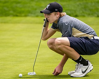 THE VINDICATOR | DIANNA OATRIDGEÊ Tanner Matig, 17, of McDonald, lines up his putt on the No. 3 green at Pine Lakes Golf Club during the Greatest Golfer of the Valley qualifier on Sunday.