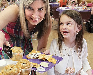 Deana Klindworth and her daughter Sophia, 6, pick out desserts during the Mommy & Me for Tea at Boardman Park on Sunday. They are from Columbiana.