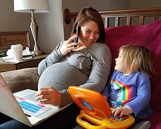 Winning entry: Ashlie Case Sletvold, a civil-rights attorney sometimes works from home, as seen here with her daughter Fiona, 3. Sletvold and her husband, Steve, are also the parents of sons Thomas, 5, and Nicholas, with whom she was pregnant in this photo, who is now 5 weeks old.