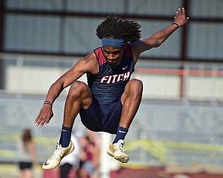 BOARDMAN, OHIO - MAY 8, 2018: Fitch's Deondre McKeever flies through the air during the boy high jump during the AAC Red Tier Track Championship at Boardman High School, Tuesday night. DAVID DERMER | THE VINDICATOR