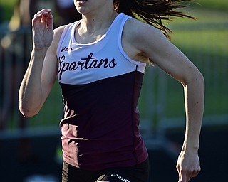 BOARDMAN, OHIO - MAY 8, 2018: Boardman's Raegan Burkey runs to the finish line during her heat of the girls 400 meter dash during the AAC Red Tier Track Championship at Boardman High School, Tuesday night. DAVID DERMER | THE VINDICATOR