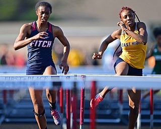 BOARDMAN, OHIO - MAY 8, 2018: Fitch's Khala Cameron and East's DeShante Allen race during their heat of the girls 100 meter hurdles during the AAC Red Tier Track Championship at Boardman High School, Tuesday night. DAVID DERMER | THE VINDICATOR