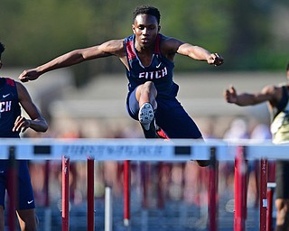 BOARDMAN, OHIO - MAY 8, 2018: Fitch's Reggie Floyd races to the finish line ahead of Fitch's Kyle Long and Harding's Emarion Perkins during the boys 110 meter hurdles during the AAC Red Tier Track Championship at Boardman High School, Tuesday night. DAVID DERMER | THE VINDICATOR