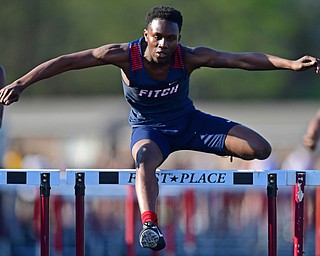 BOARDMAN, OHIO - MAY 8, 2018: Fitch's Reggie Floyd races to the finish line ahead of Fitch's Kyle Long and Harding's Emarion Perkins during the boys 110 meter hurdles during the AAC Red Tier Track Championship at Boardman High School, Tuesday night. DAVID DERMER | THE VINDICATOR