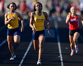 BOARDMAN, OHIO - MAY 8, 2018: East's Jahniya Bowers races to the finish line ahead of East's Kyndia Matlock and Canfield's Emerson Fletcher during the girls 100 meter dash during the AAC Red Tier Track Championship at Boardman High School, Tuesday night. DAVID DERMER | THE VINDICATOR
