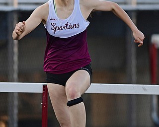 BOARDMAN, OHIO - MAY 8, 2018: Boardman's Raegan Burkey clears the last hurdle before crossing the finish line in the girls 300 meter hurdles during the AAC Red Tier Track Championship at Boardman High School, Tuesday night. DAVID DERMER | THE VINDICATOR