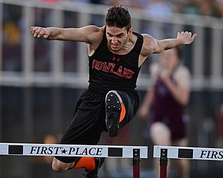 BOARDMAN, OHIO - MAY 8, 2018: Howland's Jonny Elliot clears a hurdle during the boys 300 meter hurdles during the AAC Red Tier Track Championship at Boardman High School, Tuesday night. DAVID DERMER | THE VINDICATOR