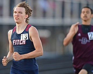 BOARDMAN, OHIO - MAY 8, 2018: Fitch's Corey Cobb-Davis sprints to the finish line ahead of Boardman's Peyton Torres during the boys 800 meter run during the AAC Red Tier Track Championship at Boardman High School, Tuesday night. DAVID DERMER | THE VINDICATOR