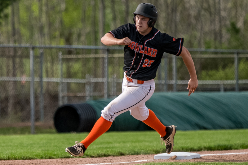 THE VINDICATOR | DIANNA OATRIDGEÊ Howland's Garrett Deemer rounds third during their Division II Sectional Final game against Cardinal Mooney Wednesday at Cene Park. Mooney won 11-2..