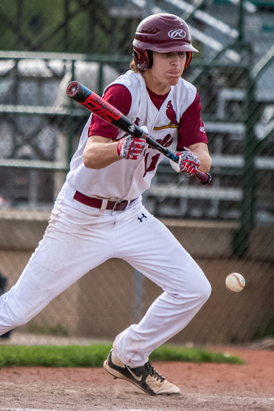 THE VINDICATOR | DIANNA OATRIDGEÊ Cardinal Mooney's Brandon Mikos lays down a bunt during their 11-2 win over Howland in the Division II Sectional Final at Cene Park on Wednesday.