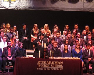 Neighbors | Zack Shively.The NHS ceremony included a candlelighting portion where students spoke about the pillars of the NHS, character, scholarship, leadership and service. A student spoke about each of the pillars and lit a candle representing the pillar. Pictured, Pranav Padmanabhar lit a candle for leadership.