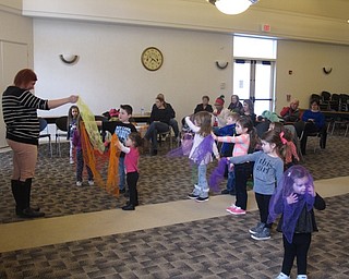 Neighbors | Zack Shively.The children at the "Gotta Move Story Time" used a couple props that librarian Mallory Wiand gave them during the program. The used beanbags and sheets of fabric for three songs.