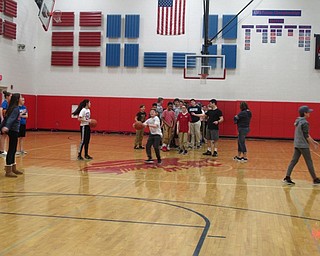 Neighbors | Zack Shively.Principal Ben Baldner said that the students enjoy the Students Versus Staff game and asked him about it throughout the school year. The event gave the cheerleaders and basketball players another event to participate in before the school year ends. Pictured, students took turns shooting half-court shots.
