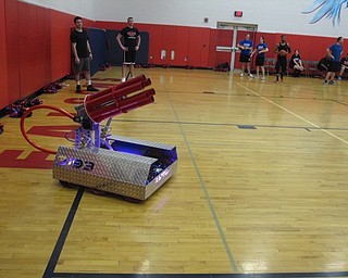 Neighbors | Zack Shively.The Students Versus Staff basketball game featured fun events between the quarters. They had the cheerleaders dance, a 50/50 raffle and a T-shirt launch. Pictured is the T-shirt launcher used by the school's robotics department.