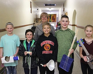 Neighbors | Abby Slanker.Peggy Flynn of the Mahoning Valley Green Team (back) visited fifth-grade students in Valerie Weingart’s science class to view the recycled materials musical instruments they made on April 17.
