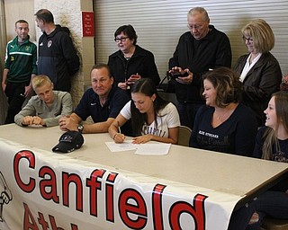 Neighbors | Abby Slanker.Surrounded by her family, Canfield High School senior soccer player Macey Malinky signed her letter-of-intent to continue her soccer career at John Carroll University at a signing ceremony in the athletic foyer of the high school on April 26.