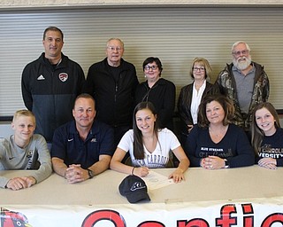 Neighbors | Abby Slanker.Canfield High School senior soccer player Macey Malinky celebrated signing her letter-of-intent to continue her soccer career at John Carroll University with her coach and family including, from left, (front) brother Cameron, father Shawn, mother Carie, sister Alli; (back) CHS Girls Soccer Head Coach Phil Simone, and grandparents George and Diane Malinky and Kathi and Rich Hernanskey on April 26.