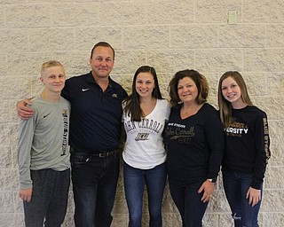 Neighbors | Abby Slanker.The Malinky family, from left, Cameron, Shawn, Carie and Alli, feted Canfield High School senior soccer player Macey Malinky (center) as she signed her letter-of-intent to continue her soccer career at John Carroll University at a signing ceremony in the athletic foyer of the high school.