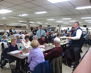 Neighbors | Zack Shively.Austintown Fitch High School served senior citizens of the community at their spring Senior Dinner on April 25. School representatives and students gave the seniors food and drinks during the event. Pictured, middle school assistant principal Dominick Daltorio and the high school's junior principal Jim Penk passed out salads during the event.