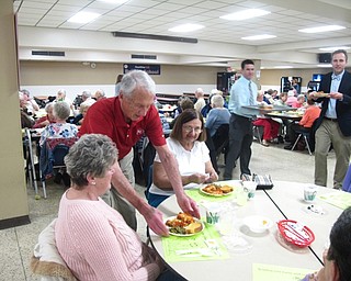 Neighbors | Zack Shively.The Senior Dinner has become a tradition at the school. Superintendent Vincent Colaluca said the event is expected of the school. They have the event once in the fall and again in the spring. Pictured, David Ritchie, a long-serving board member, helped hand out the dinners to the seniors.