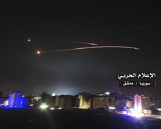 Missiles rise into the sky as Israeli missiles hit air defense position and other military bases, in Damascus, Syria. The Israeli military on Thursday said it attacked “dozens” of Iranian targets in neighboring Syria in response to an Iranian rocket barrage on Israeli positions in the Golan Heights, in the most serious military confrontation between the two bitter enemies 