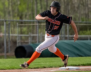 THE VINDICATOR | DIANNA OATRIDGEÊ Howland's Garrett Deemer rounds third during their Division II Sectional Final game against Cardinal Mooney Wednesday at Cene Park. Mooney won 11-2..