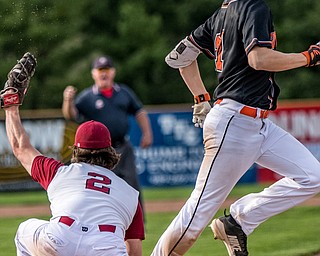 THE VINDICATOR | DIANNA OATRIDGEÊ Cardinal Mooney's first baseman Anthony Potesta makes the catch to force out Howland's Frankie Manios during their Division II Sectional Final tournament game at Cene Park on Wednesday. Mooney won 11-2.