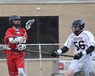 William D. Lewis The Vindicator Canfield's (1) passes around Boardman's (56) during 5-11-18 at Boardman.
