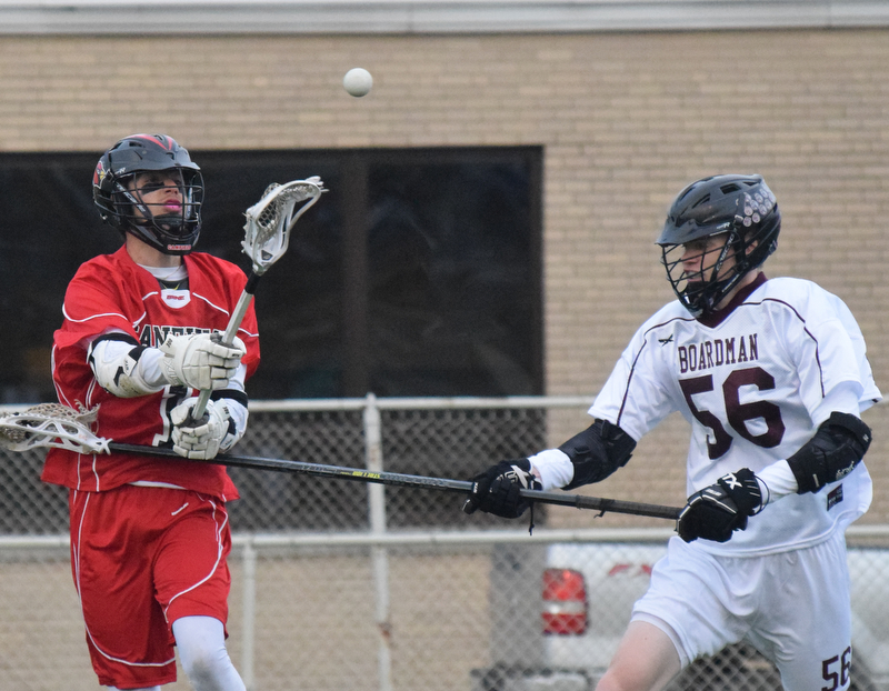 William D. Lewis The Vindicator Canfield's (1) passes around Boardman's (56) during 5-11-18 at Boardman.