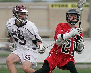 William D. Lewis The VindicatorCanfield's 21 moves the ball past Boardman's 55..