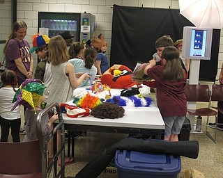 Neighbors | Zack Shively.The students of Stadium Drive Elementary also had a photo booth and dancing area in addition to ice cream at the Ice Cream Social. The adults could win family prizes in a basket raffle as well.