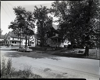89.119 B2F61 N.   View looking North-West along Lincoln Avenue toward Fifth Avenue, Hotel West later Hotel Allison with tower, Home of Mr. and Mrs. George Adams, later rooming house, rooming house on NE corner double house;.1963. Archives, original negative is 4" x 5" black and white. Digital image is 800 dpi RGB.