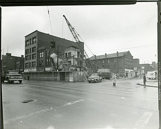 89.119 B3F6 Photographic print of the view looking north toward the corner of E. Federal Street and Watt Street. Clearance for the Downtown Loop.  Boardman Hotel, Superior Chemical Products Co., Salvation Army Citadel are on the right. SS. Cyril & Methodious Roman Catholic Church is on left in the background.  Demolition of Pesas Wallpaper & Paint, and Hume's Furniture. Same as B3F5. Archives, original print is 4" x 5" black and white. Digital image is 800 dpi RGB.