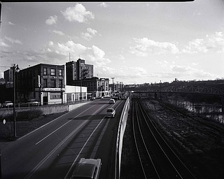 89.119 B1F267 N.   View looking East from the Spring Common Bridge, toward the Western End of the Central Business District and Front St, Valley Hotel, Jolly Bar, Hotel Youngstown, PRR Tracks, Marshall St. Bridge.1960. Archives, original negative is 4" x 5" black and white. Digital image is 800 dpi RGB.