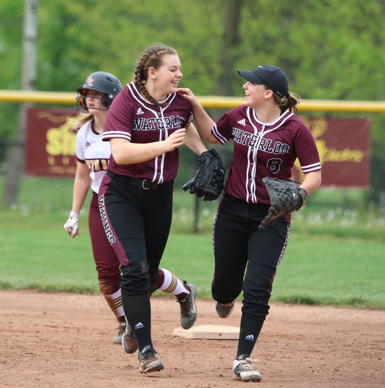 Laura Hood (14) and Brooke Twichell (8) of Waterloo celebrate a double play during their matchup against South Range on Monday night. Dustin Livesay  |  The Vindicator  5/14/18  Canfield
