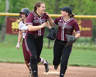 Laura Hood (14) and Brooke Twichell (8) of Waterloo celebrate a double play during their matchup against South Range on Monday night. Dustin Livesay  |  The Vindicator  5/14/18  Canfield