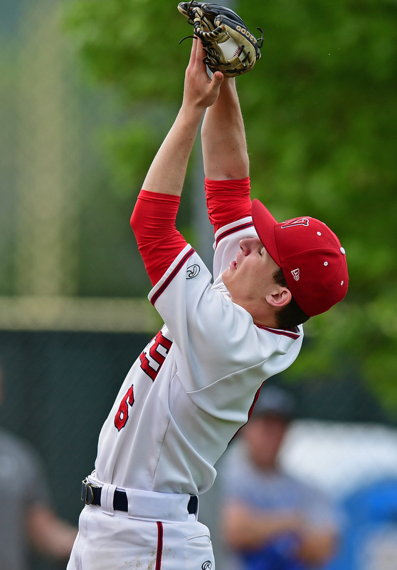 STRUTHERS, OHIO - MAY 15, 2018: Niles starting pitcher Marco Defalco catches a pop up by Poland's Mike Masucci in the third inning of their OHSAA tournament game on Tuesday afternoon at Cene Park. Niles won 4-3. DAVID DERMER | THE VINDICATOR