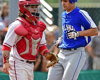 STRUTHERS, OHIO - MAY 15, 2018: Poland's Braeden O'Shaughnessy scores a run in the third inning of their OHSAA tournament game on Tuesday afternoon at Cene Park. Niles won 4-3. DAVID DERMER | THE VINDICATOR..Niles catcher Nick Guarnieri pictured.